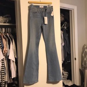 Frame LeHigh Flare jeans in a light blue wash.